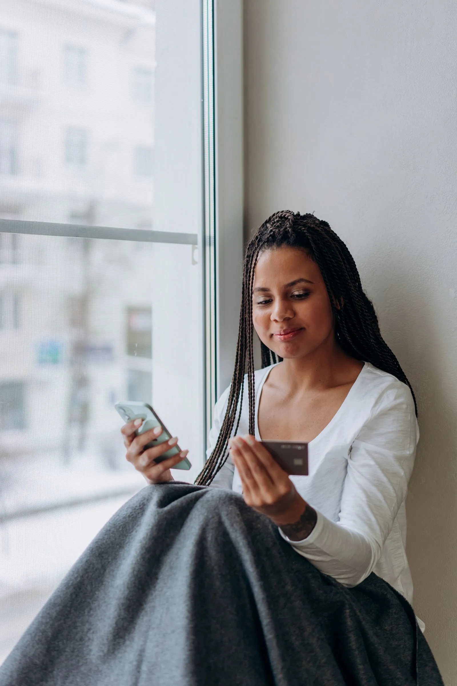 Filipino freelancer checking a payment account on a smartphone